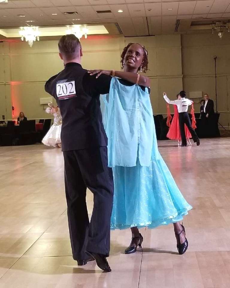Dancing with teacher at DanceSport competition