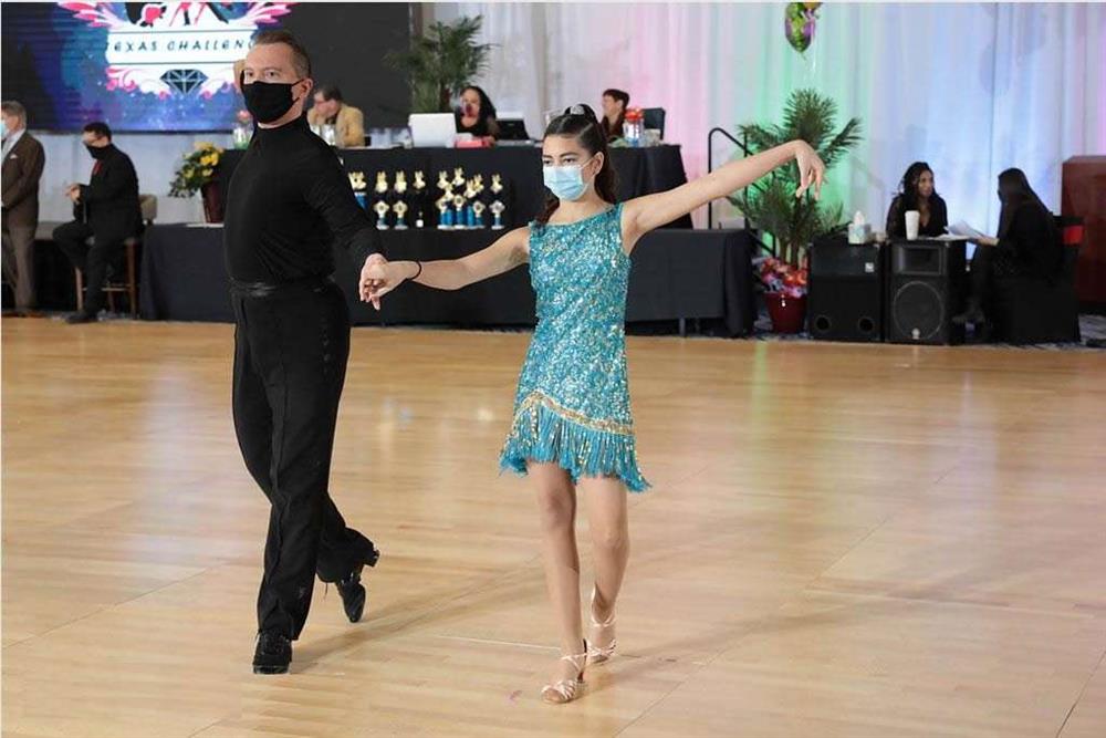 Dancing with teacher at DanceSport competition