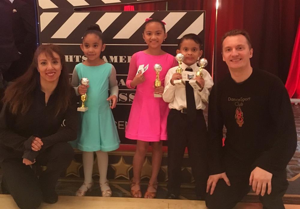 Happy Children with trophies at DanceSport Competition