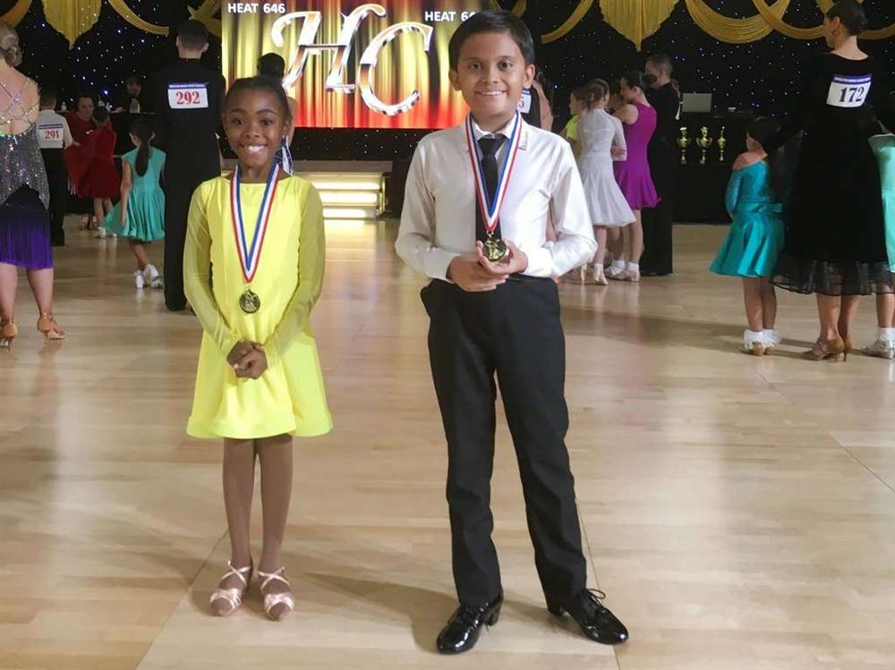 Tobia and Naya receiving awards at 2022 Houston DanceSport Classic